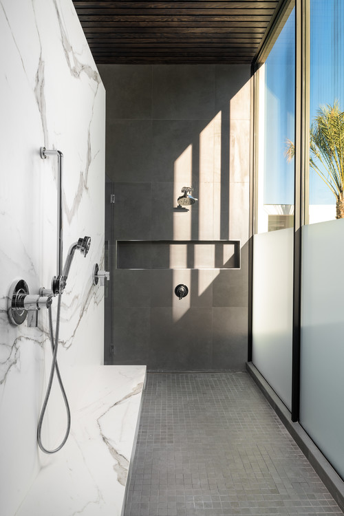Experience Serenity: A Minimalist Gray White Bathroom with a Marble Wall Walk-in Shower