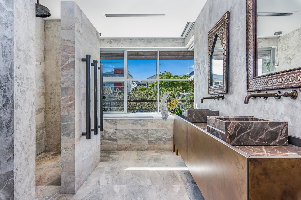 Design ideas for a world-inspired ensuite bathroom in Perth with a built-in shower, beige tiles, grey tiles, grey walls, a vessel sink, beige floors, an open shower and brown worktops.