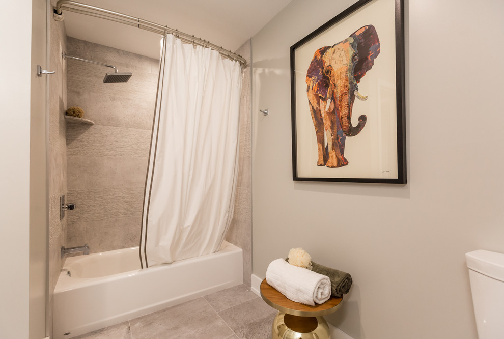 Inspiration for a medium sized eclectic shower room bathroom in Philadelphia with a built-in bath, a shower/bath combination, grey walls, porcelain flooring, grey floors and a shower curtain.