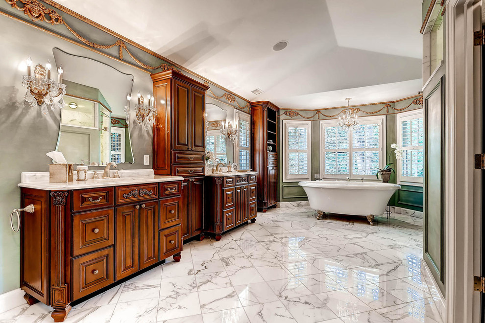 Bathroom - huge traditional master white tile and stone tile marble floor bathroom idea in Denver with an undermount sink, raised-panel cabinets, medium tone wood cabinets, marble countertops, a two-piece toilet and blue walls