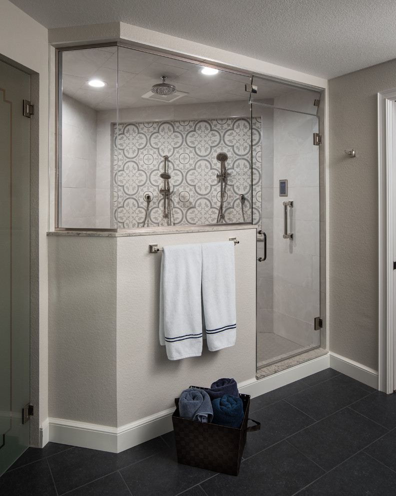 Example of a large country master white tile and porcelain tile ceramic tile and gray floor double shower design in Denver with furniture-like cabinets, distressed cabinets, a two-piece toilet, beige walls, a drop-in sink, quartz countertops, a hinged shower door and multicolored countertops