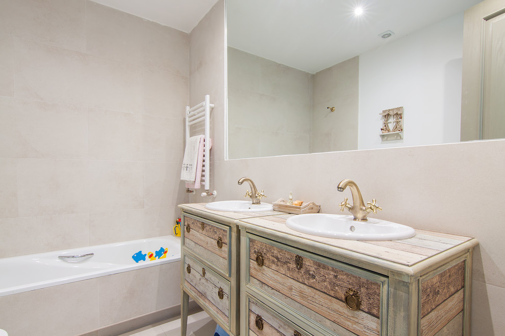 Example of a small transitional master bathroom design in Madrid with furniture-like cabinets, distressed cabinets, beige walls and an undermount sink