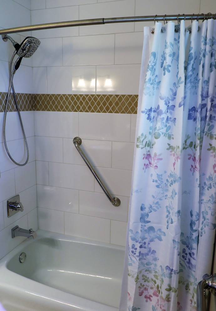 Small classic ensuite bathroom in Minneapolis with shaker cabinets, brown cabinets, an alcove bath, a two-piece toilet, white tiles, ceramic tiles, beige walls, mosaic tile flooring, a submerged sink, solid surface worktops, green floors and beige worktops.