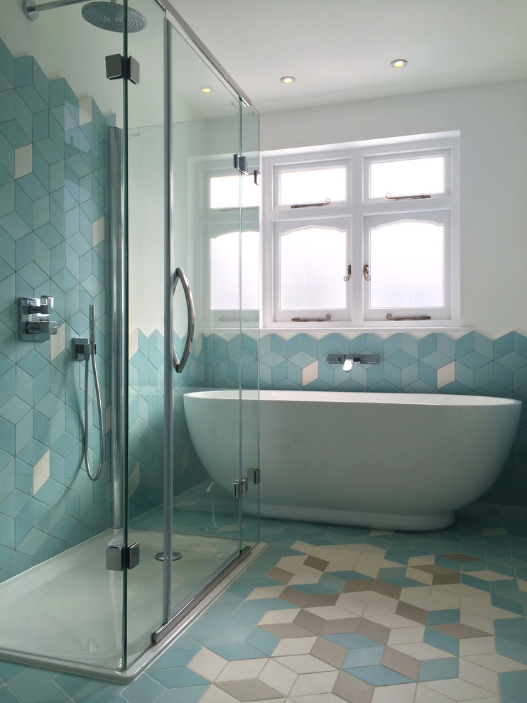 Design ideas for a contemporary family bathroom in London with a freestanding bath, multi-coloured tiles, ceramic tiles and ceramic flooring.