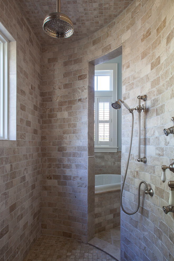 Exemple d'une salle de bain principale chic avec une baignoire posée, une douche double, un carrelage beige, un carrelage de pierre et aucune cabine.