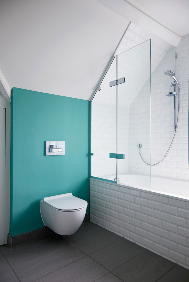 Inspiration for a transitional white tile and subway tile gray floor bathroom remodel in Surrey with a wall-mount toilet and green walls