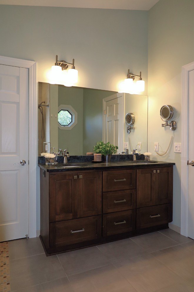 This is an example of a medium sized classic ensuite bathroom in Minneapolis with shaker cabinets, brown cabinets and soapstone worktops.