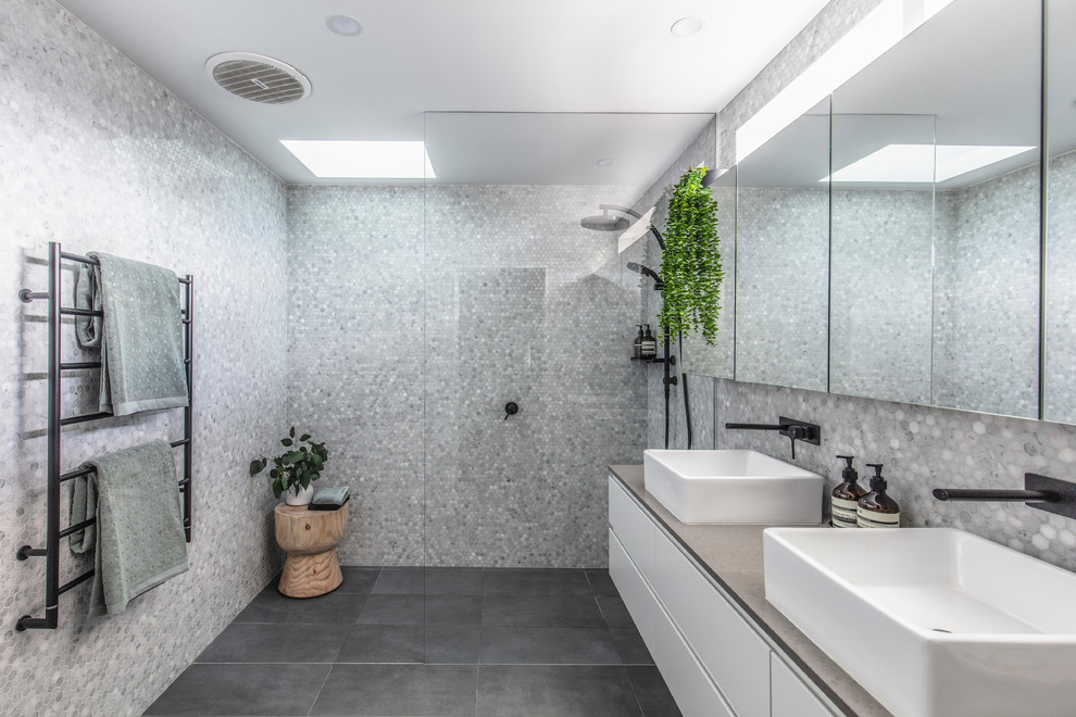 Photo of a medium sized contemporary ensuite bathroom in Other with white cabinets, a walk-in shower, grey tiles, marble tiles, ceramic flooring, engineered stone worktops, grey floors, an open shower and grey worktops.
