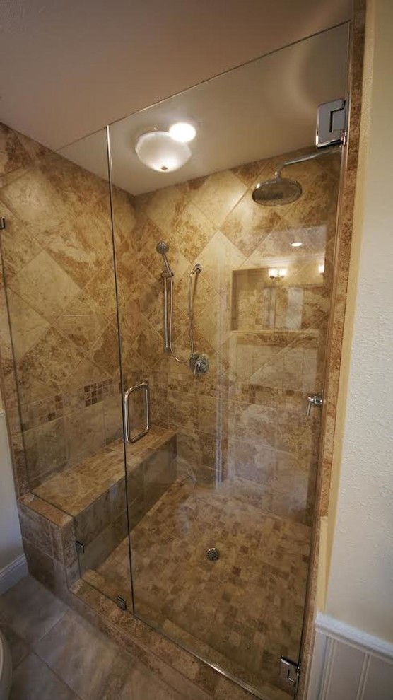 Photo of a medium sized traditional shower room bathroom in Sacramento with raised-panel cabinets, dark wood cabinets, a built-in bath, a walk-in shower, a one-piece toilet, beige tiles, white tiles, stone tiles, beige walls, ceramic flooring, a built-in sink and tiled worktops.