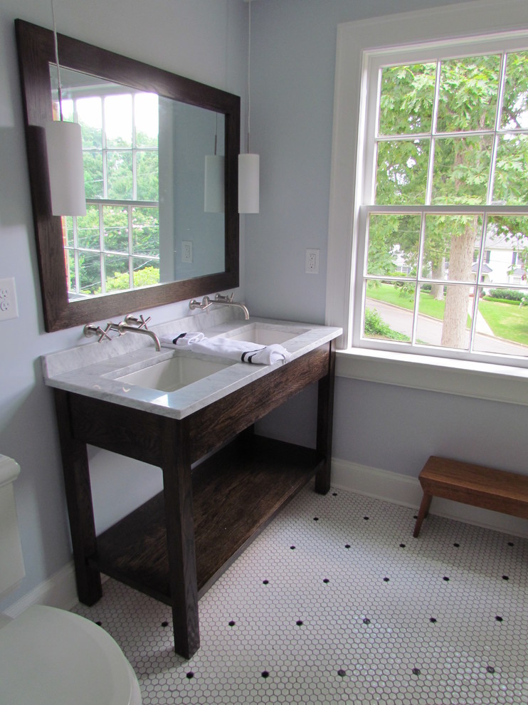 Photo of a large traditional ensuite bathroom in Raleigh with a submerged sink, open cabinets, medium wood cabinets, marble worktops, a shower/bath combination, a two-piece toilet, white tiles, stone tiles, blue walls and marble flooring.