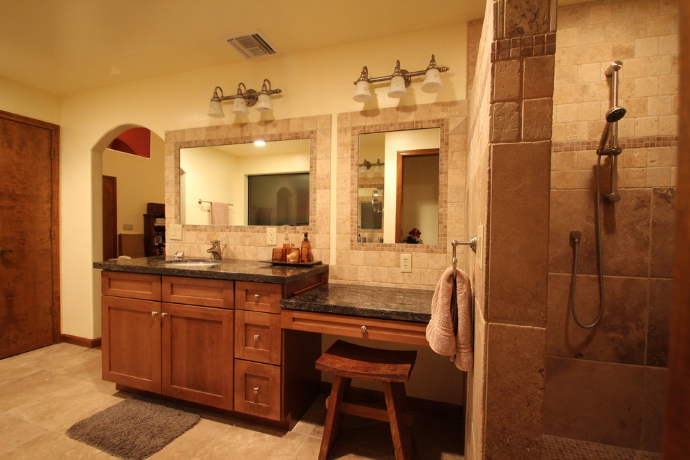 Large transitional master beige tile and stone tile ceramic tile bathroom photo in Phoenix with an undermount sink, recessed-panel cabinets, medium tone wood cabinets, granite countertops, a two-piece toilet and yellow walls