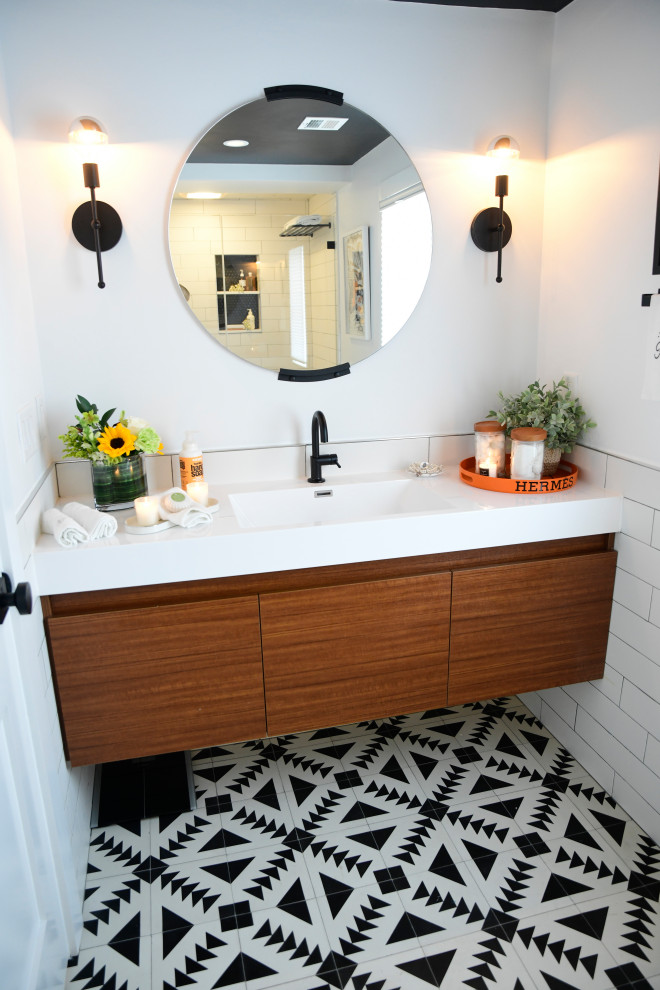 Photo of a medium sized modern family bathroom in Boston with freestanding cabinets, light wood cabinets, a built-in bath, white walls, a built-in sink, a sliding door and a built in vanity unit.