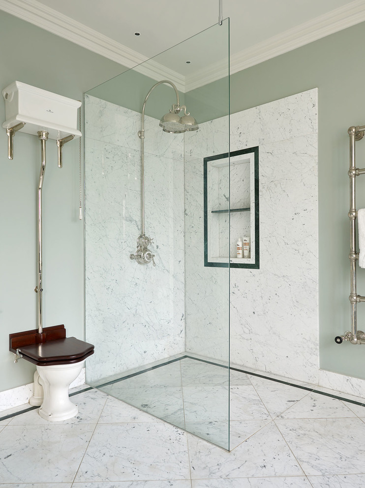 This is an example of a large traditional family bathroom in London with a built-in bath, a corner shower, a two-piece toilet, marble worktops and an open shower.
