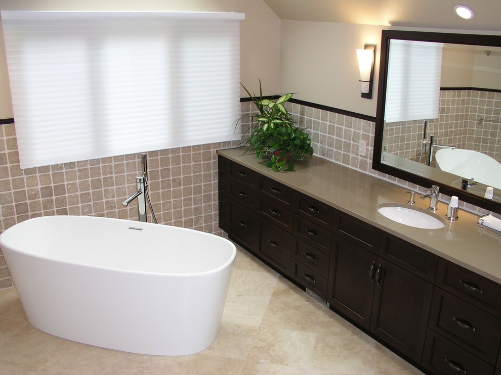 This is an example of a contemporary bathroom in New York with a freestanding bath.