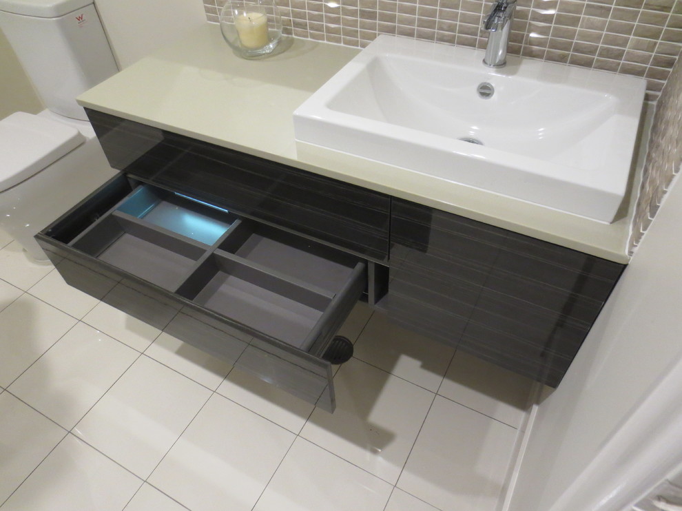 This is an example of a large modern shower room bathroom in Brisbane with freestanding cabinets, dark wood cabinets, a corner shower, white tiles, porcelain tiles and porcelain flooring.