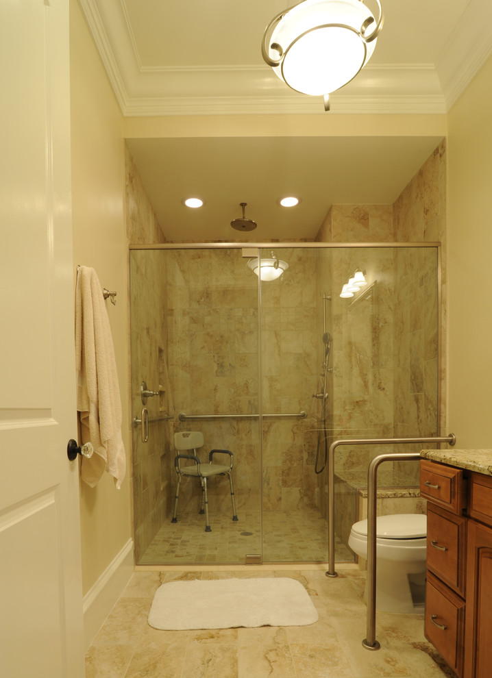 Design ideas for a traditional family bathroom in San Francisco with a submerged sink, freestanding cabinets, medium wood cabinets, granite worktops, an alcove shower, a two-piece toilet, beige tiles, stone tiles, beige walls and porcelain flooring.