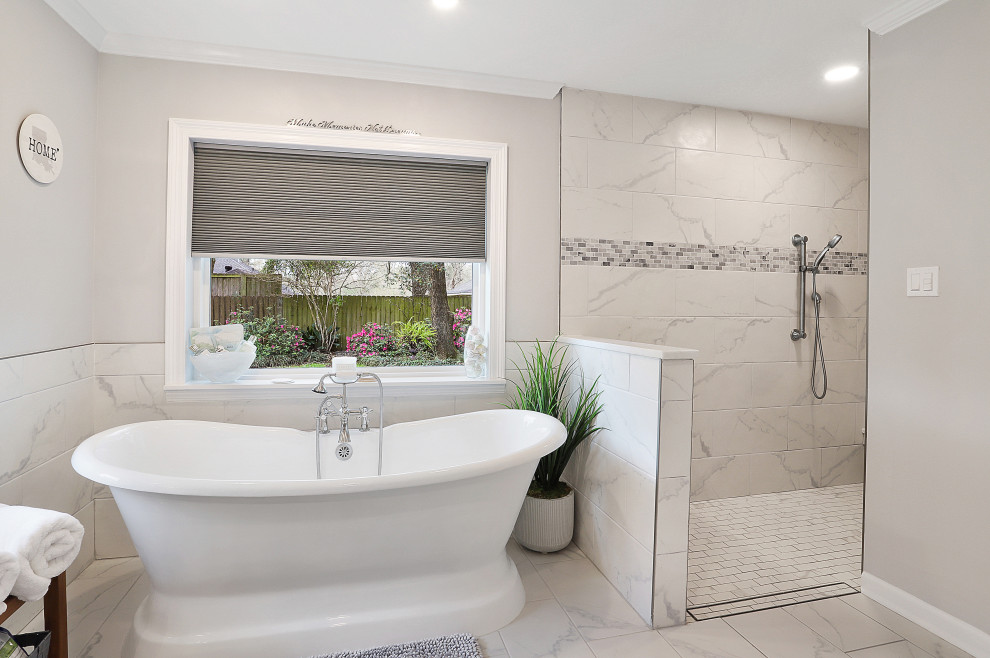Large classic ensuite bathroom in New Orleans with shaker cabinets, grey cabinets, a freestanding bath, a built-in shower, a two-piece toilet, white tiles, porcelain tiles, grey walls, porcelain flooring, a submerged sink, marble worktops, white floors, an open shower and white worktops.