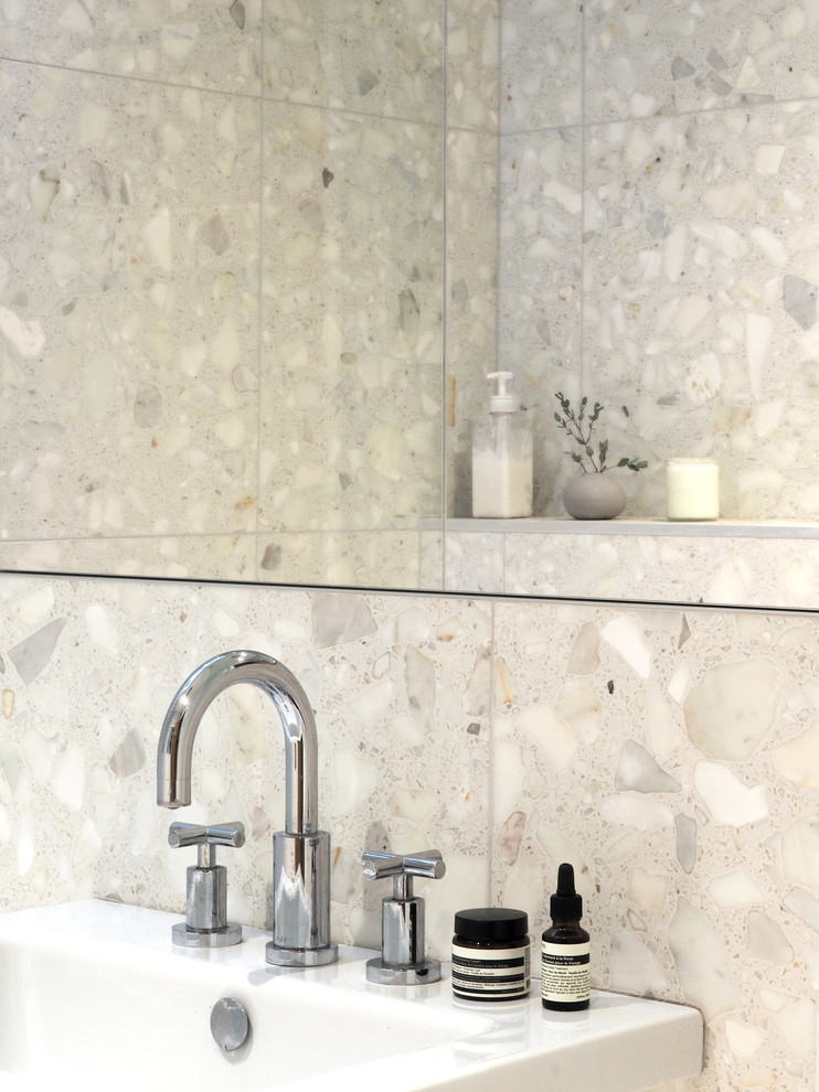 This is an example of a small contemporary bathroom in Montreal with beige tiles, marble tiles, terrazzo flooring, beige floors and an open shower.