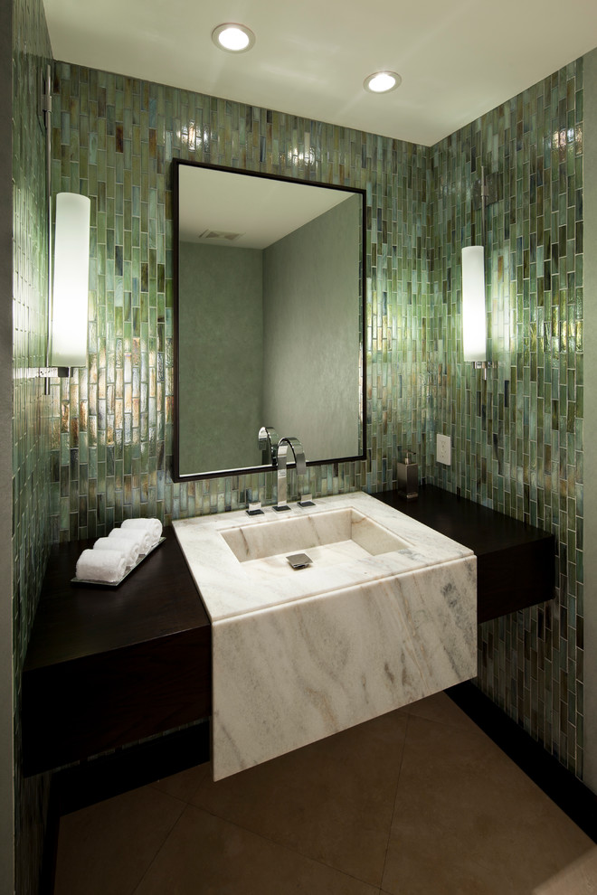 This is an example of a medium sized contemporary bathroom in Miami with an integrated sink, green tiles, ceramic flooring and beige floors.