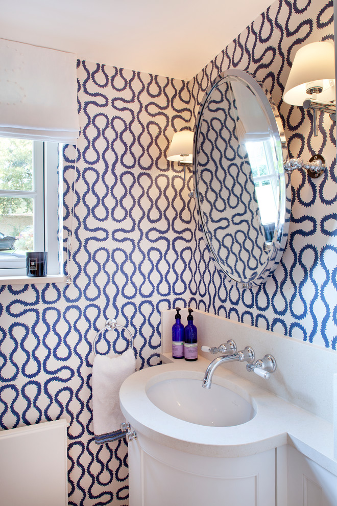 Bathroom - contemporary bathroom idea in London with an undermount sink, recessed-panel cabinets, white cabinets, multicolored walls and white countertops