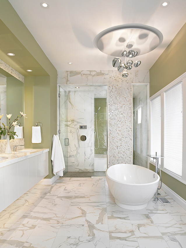 Design ideas for a large contemporary ensuite bathroom in Edmonton with flat-panel cabinets, white cabinets, a freestanding bath, an alcove shower, white tiles, glass tiles, marble flooring, a submerged sink, quartz worktops, white floors and a hinged door.