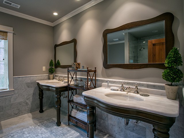 Inspiration for a large rustic master gray tile and marble tile marble floor and white floor corner shower remodel in Huntington with open cabinets, brown cabinets, gray walls, an undermount sink, marble countertops and a hinged shower door