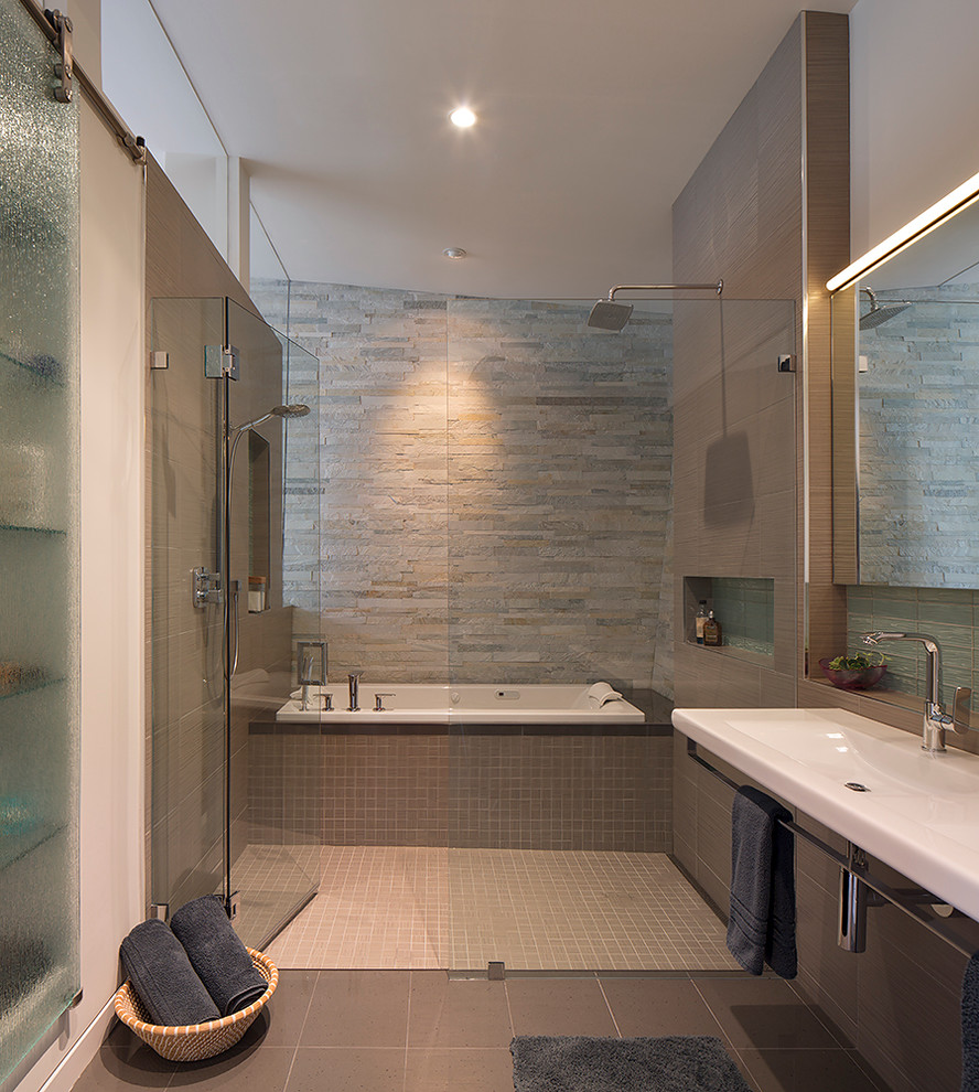 Example of a trendy beige tile bathroom design in San Francisco with a trough sink