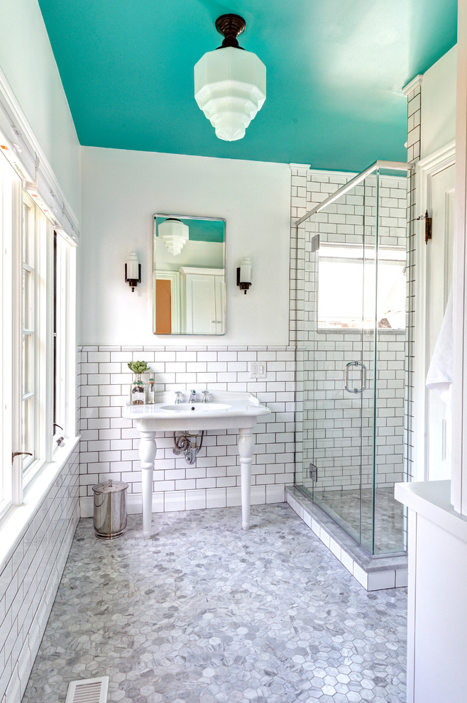 This is an example of a small traditional grey and teal ensuite bathroom in Columbus with a console sink, white tiles, metro tiles and marble flooring.