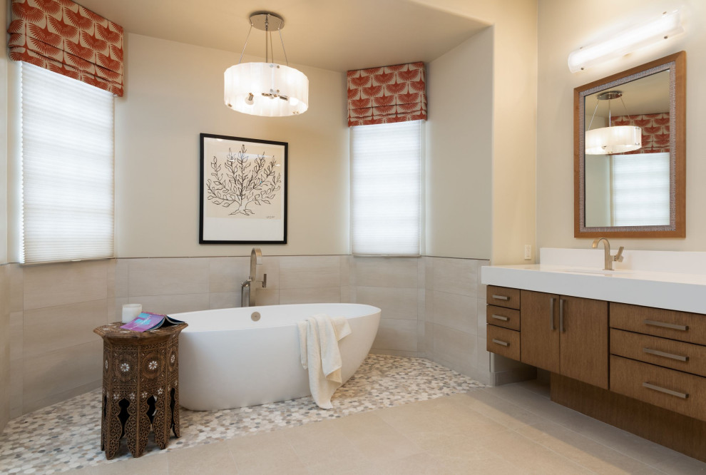 Example of a large 1960s master beige tile and porcelain tile porcelain tile, beige floor and double-sink bathroom design in Phoenix with flat-panel cabinets, light wood cabinets, beige walls, an undermount sink, quartz countertops, a hinged shower door, white countertops and a floating vanity