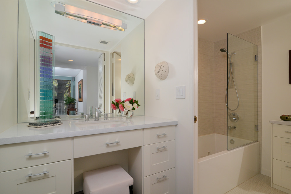 Example of a mid-sized trendy master beige tile and porcelain tile bathroom design in Sacramento with recessed-panel cabinets, white cabinets and white walls