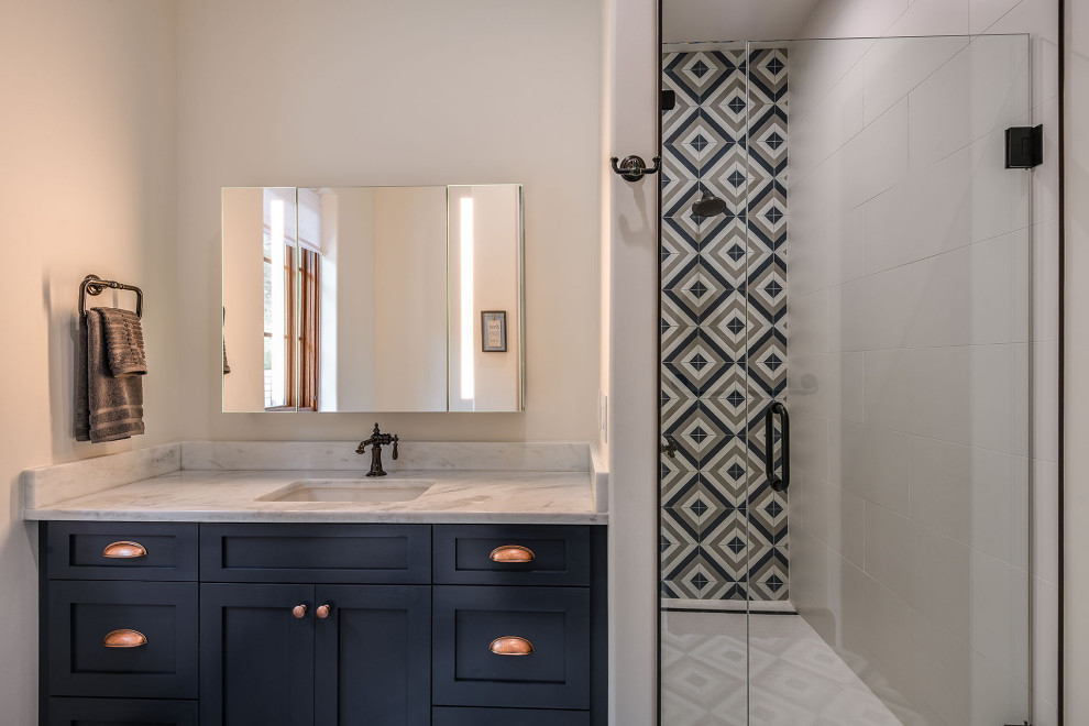 Small tuscan porcelain tile, multicolored floor and single-sink walk-in shower photo in Orlando with shaker cabinets, turquoise cabinets, a one-piece toilet, white walls, an undermount sink, quartzite countertops, a hinged shower door, white countertops and a built-in vanity