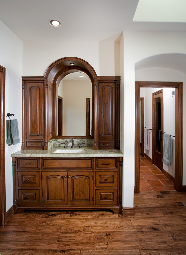 Expansive traditional ensuite bathroom in Los Angeles with a submerged sink, freestanding cabinets, medium wood cabinets, granite worktops, a double shower and medium hardwood flooring.
