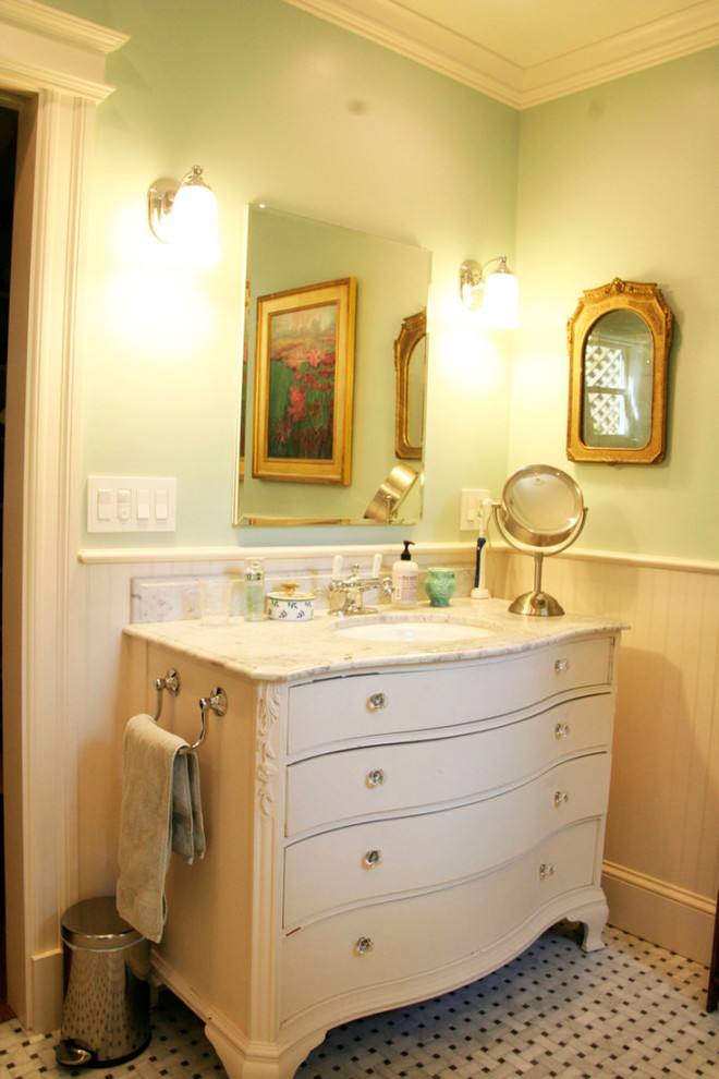 Bathroom - small traditional 3/4 ceramic tile ceramic tile bathroom idea in New Orleans with furniture-like cabinets, distressed cabinets, green walls, an undermount sink and marble countertops