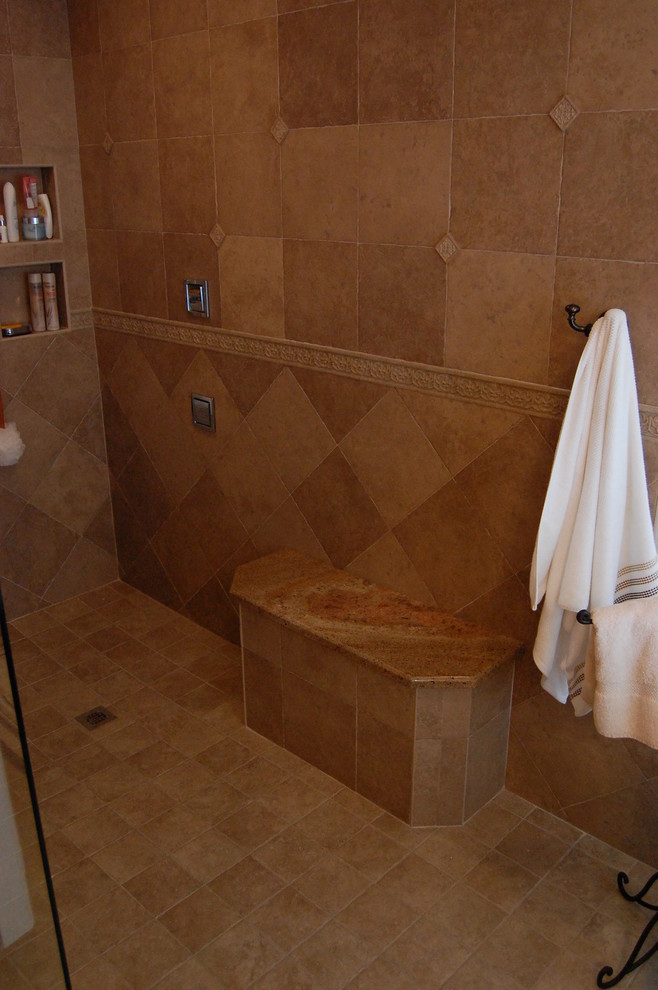 Elegant master beige tile and stone tile travertine floor doorless shower photo in Tampa