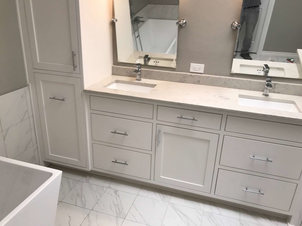 Bathroom - large contemporary master white tile and porcelain tile porcelain tile and white floor bathroom idea in Dallas with shaker cabinets, white cabinets, gray walls, an undermount sink, quartzite countertops and a hinged shower door