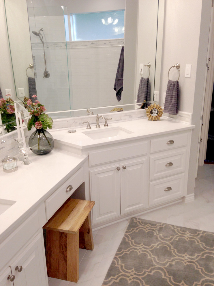 Medium sized classic ensuite bathroom in Dallas with a submerged sink, raised-panel cabinets, white cabinets, quartz worktops, a double shower, white tiles, metro tiles, grey walls and porcelain flooring.