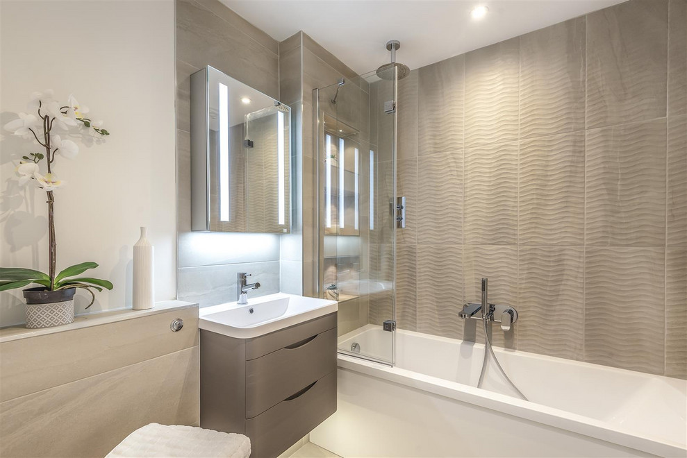 Bathroom - mid-sized contemporary kids' gray tile and cement tile cement tile floor and gray floor bathroom idea in London with flat-panel cabinets, dark wood cabinets, a wall-mount toilet, gray walls, a wall-mount sink and a hinged shower door