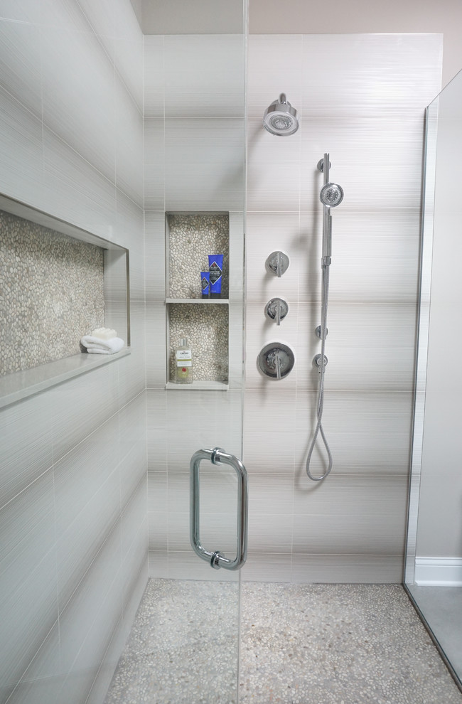 Inspiration for a mid-sized contemporary master white tile and ceramic tile cement tile floor and gray floor walk-in shower remodel in Chicago with shaker cabinets, white cabinets, a one-piece toilet, beige walls, an undermount sink, solid surface countertops, a hinged shower door and white countertops