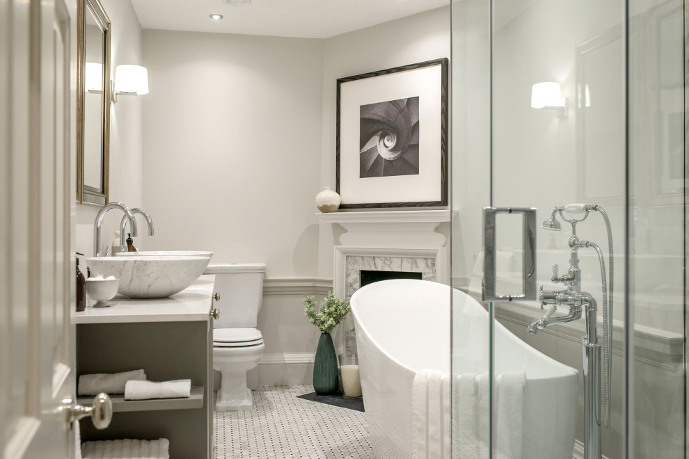 Large classic ensuite bathroom in London with shaker cabinets, grey walls, quartz worktops, grey floors, a hinged door, grey cabinets, a freestanding bath, a corner shower, mosaic tile flooring, a vessel sink and white worktops.