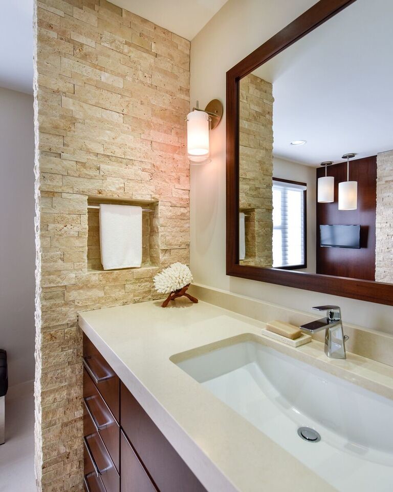 Design ideas for a medium sized contemporary ensuite bathroom in DC Metro with flat-panel cabinets, medium wood cabinets, a two-piece toilet, beige tiles, stone tiles, beige walls, travertine flooring, a submerged sink, engineered stone worktops, an alcove shower, beige floors and a hinged door.