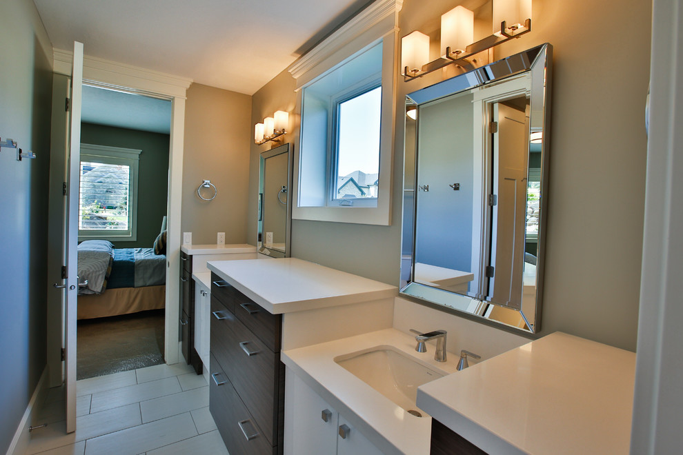 Photo of a large traditional family bathroom in Salt Lake City with a submerged sink, flat-panel cabinets, white cabinets, grey tiles, grey walls, quartz worktops, a submerged bath, a shower/bath combination, porcelain tiles and porcelain flooring.