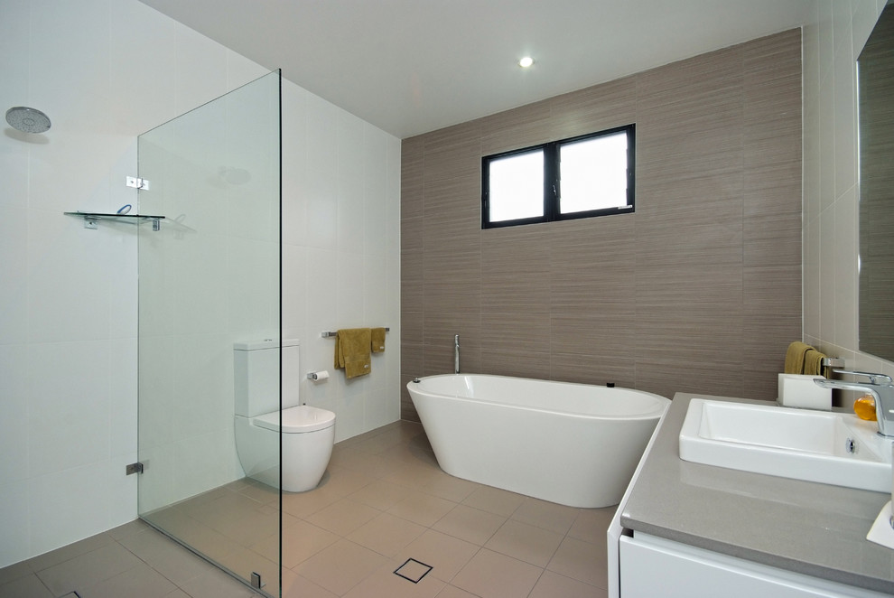 Contemporary bathroom in Newcastle - Maitland with a freestanding bath and ceramic flooring.