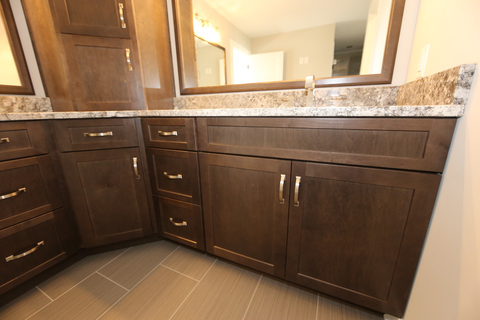 Alcove bathtub - mid-sized transitional master brown tile and porcelain tile porcelain tile alcove bathtub idea in Chicago with shaker cabinets, dark wood cabinets, a two-piece toilet, gray walls, an undermount sink and granite countertops