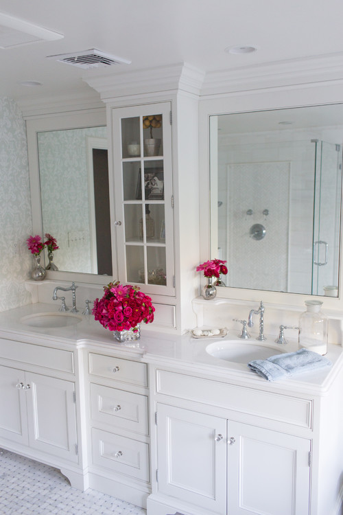 White shaker bathroom cabinets with double vanity, glass-door tower, quartz countertop, and chrome faucets.