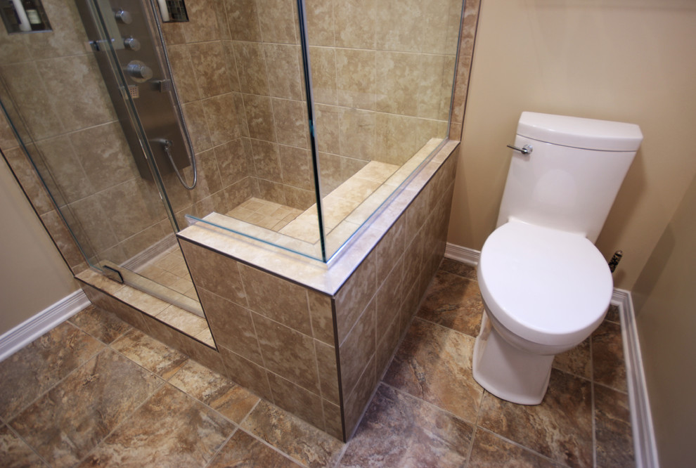 This is an example of a medium sized contemporary shower room bathroom in Ottawa with a one-piece toilet, beaded cabinets, dark wood cabinets, a console sink, a corner shower, beige walls and ceramic flooring.