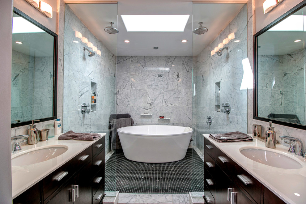 Example of a large transitional master gray tile and stone tile mosaic tile floor bathroom design in San Diego with flat-panel cabinets, dark wood cabinets, gray walls, an undermount sink and quartzite countertops