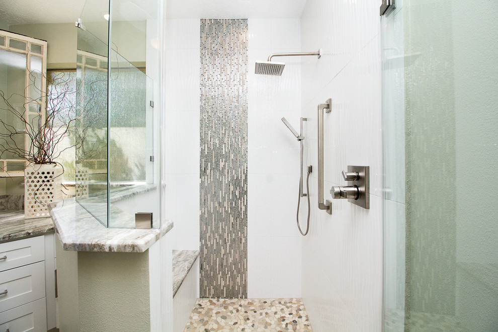 Example of a large trendy master white tile and porcelain tile porcelain tile and beige floor corner shower design in Houston with shaker cabinets, white cabinets, gray walls, an undermount sink, a hinged shower door, quartzite countertops and white countertops