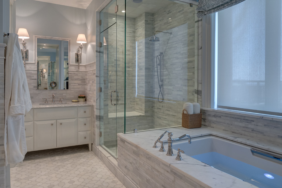 Inspiration for a timeless master gray tile marble floor doorless shower remodel in Philadelphia with white cabinets, an undermount sink, raised-panel cabinets, marble countertops, an undermount tub and blue walls