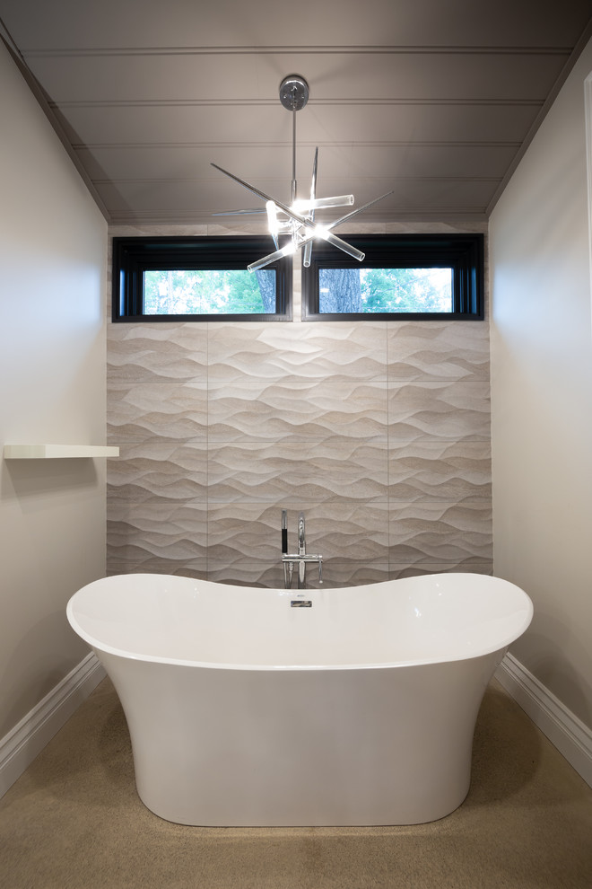 Inspiration for a large traditional ensuite bathroom in Toronto with a freestanding bath, a one-piece toilet, white tiles, beige walls, concrete flooring and grey floors.
