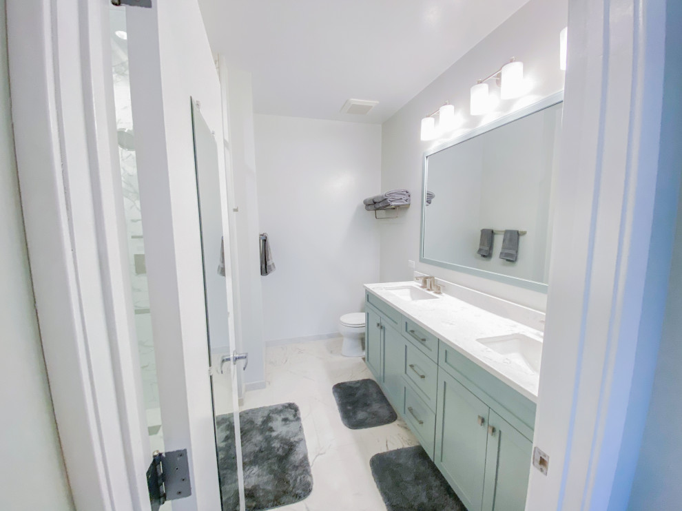 Example of a minimalist master black and white tile and porcelain tile porcelain tile and multicolored floor bathroom design in Chicago with gray walls, an undermount sink and a hinged shower door